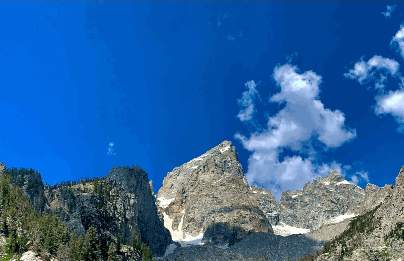 Granite peaks of the Teton range rising into a deep blue sky